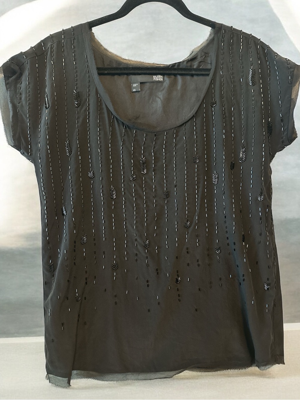 Eileen Fisher beaded silk top in black.
